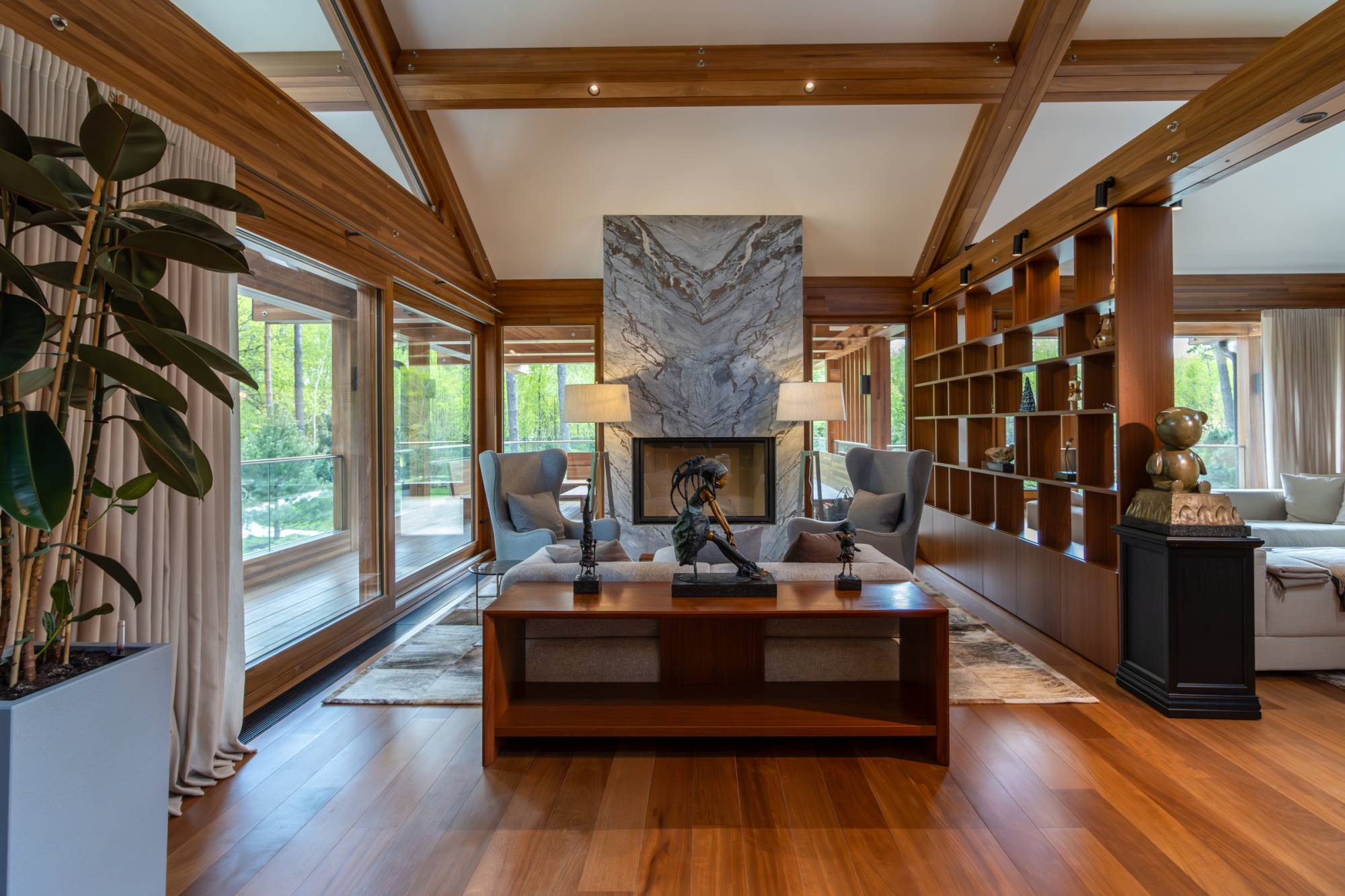 Pagano-house-wood-luxury-villa-boschi-living-fireplace-bookshelf