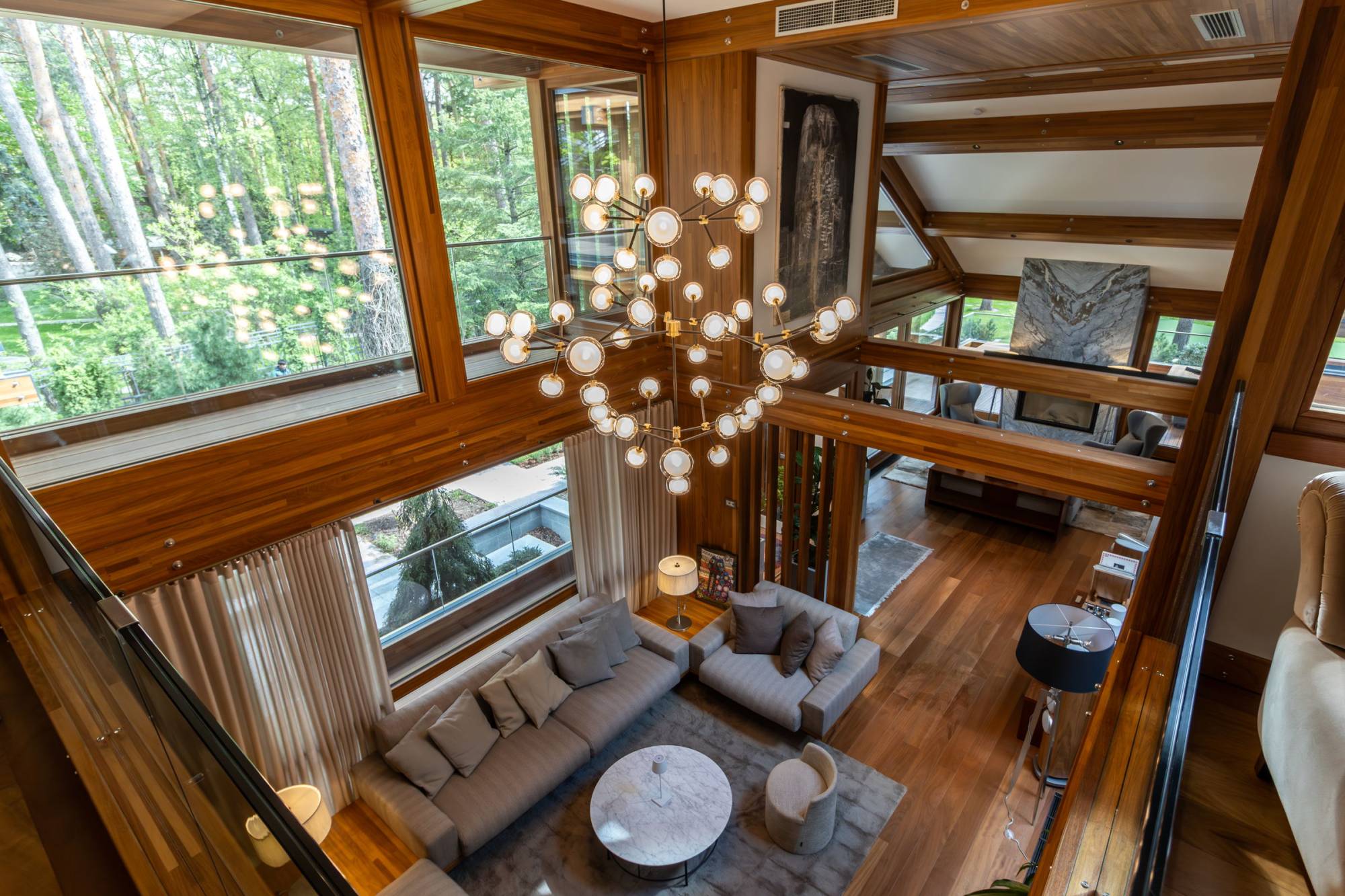Pagano-house-wood-luxury-villa-boschi-living-chandelier-aerial