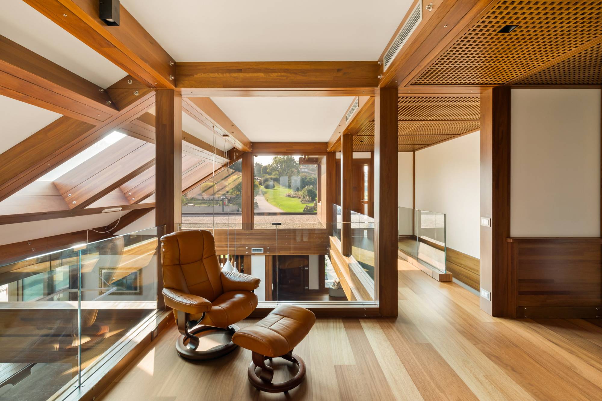 Pagano-house-wood-luxury-villa-varese-mezzanine-beams-armchair